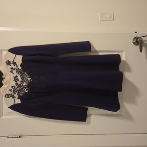 Purple and white mini skirt with purple embroidery